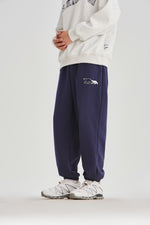 Navy Blue Embroidered Sweatpants Close-up | Weezy
