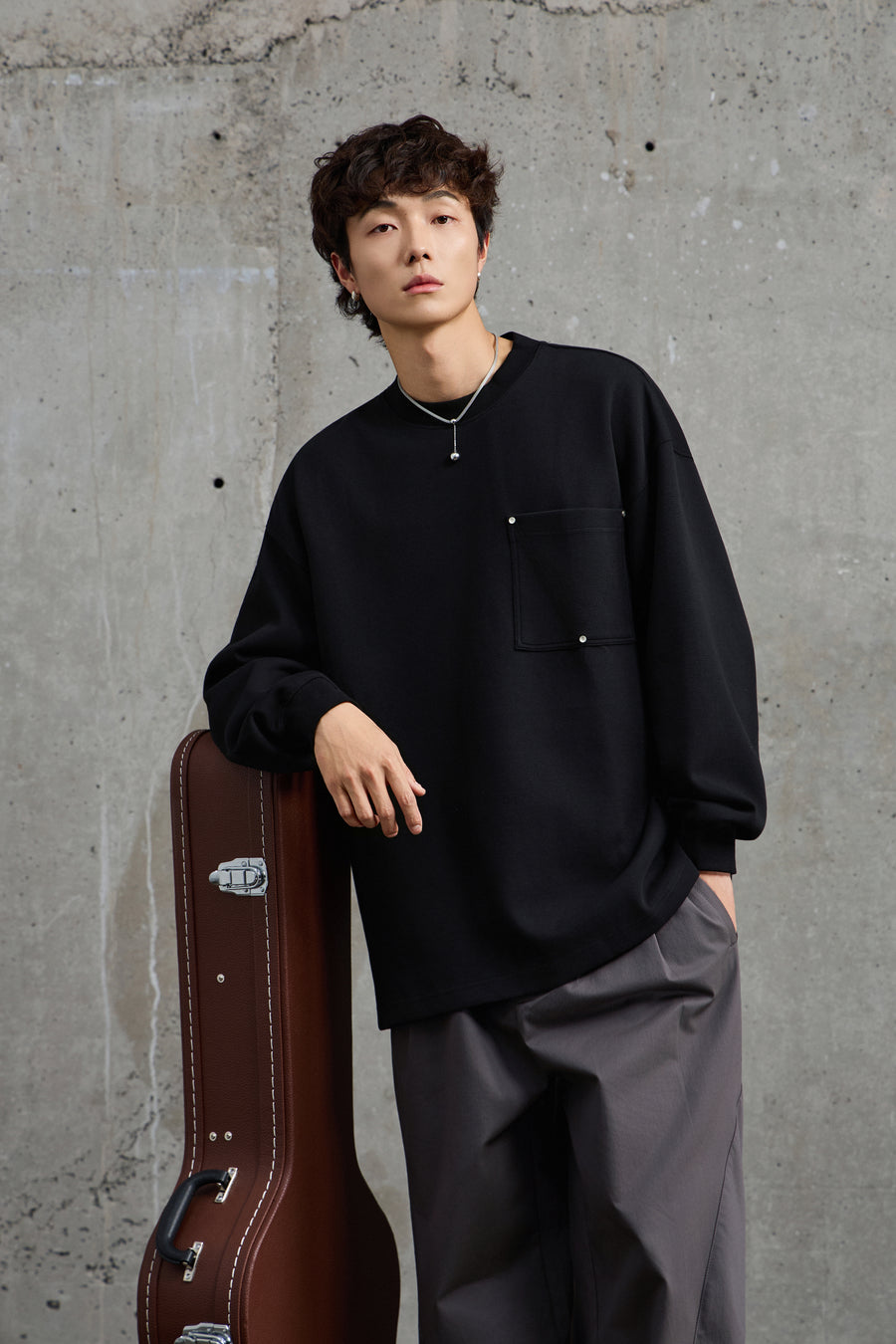 Unisex Black Pullover With Button Accents Front view | Weezy