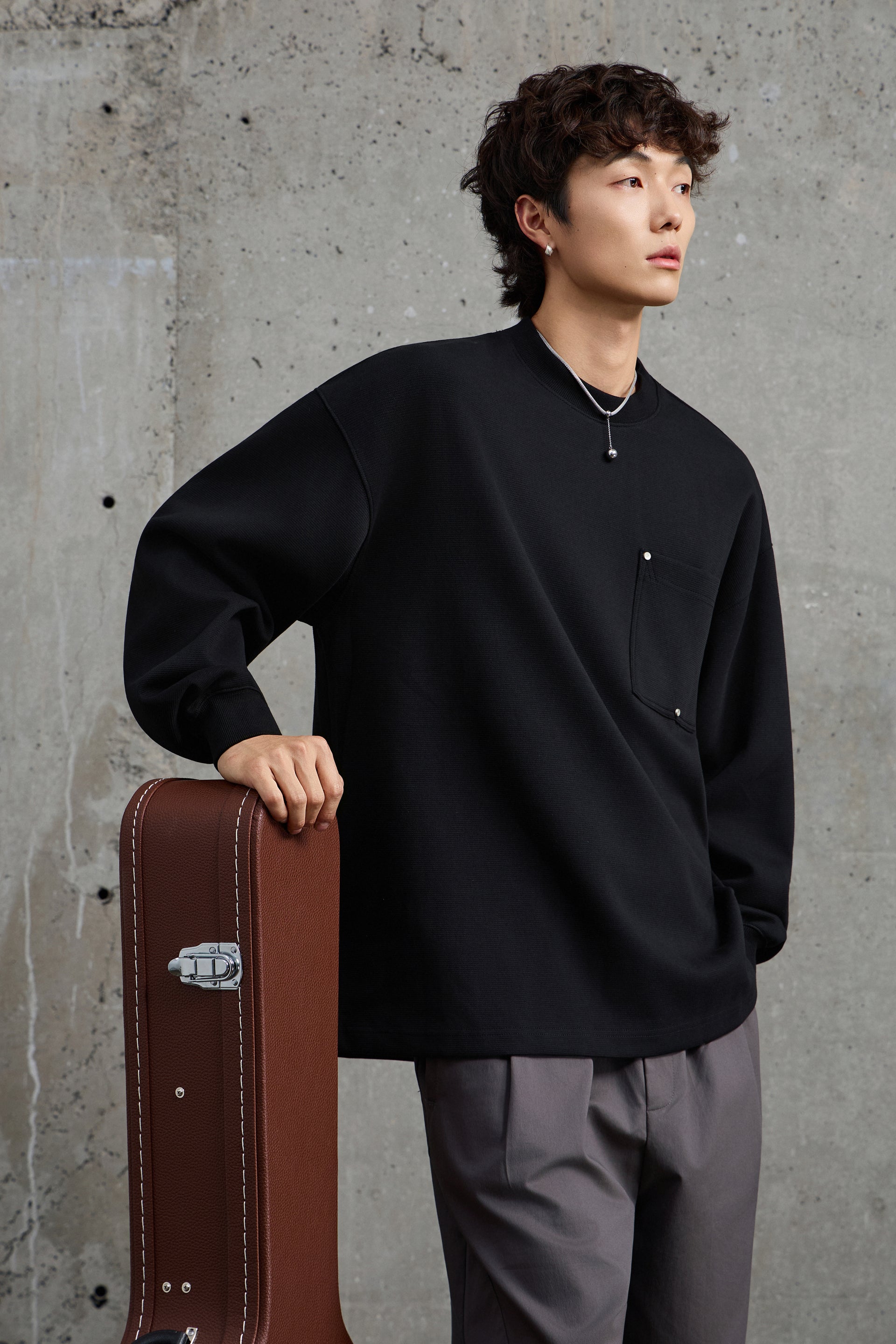 Unisex Black Pullover With Button Accents