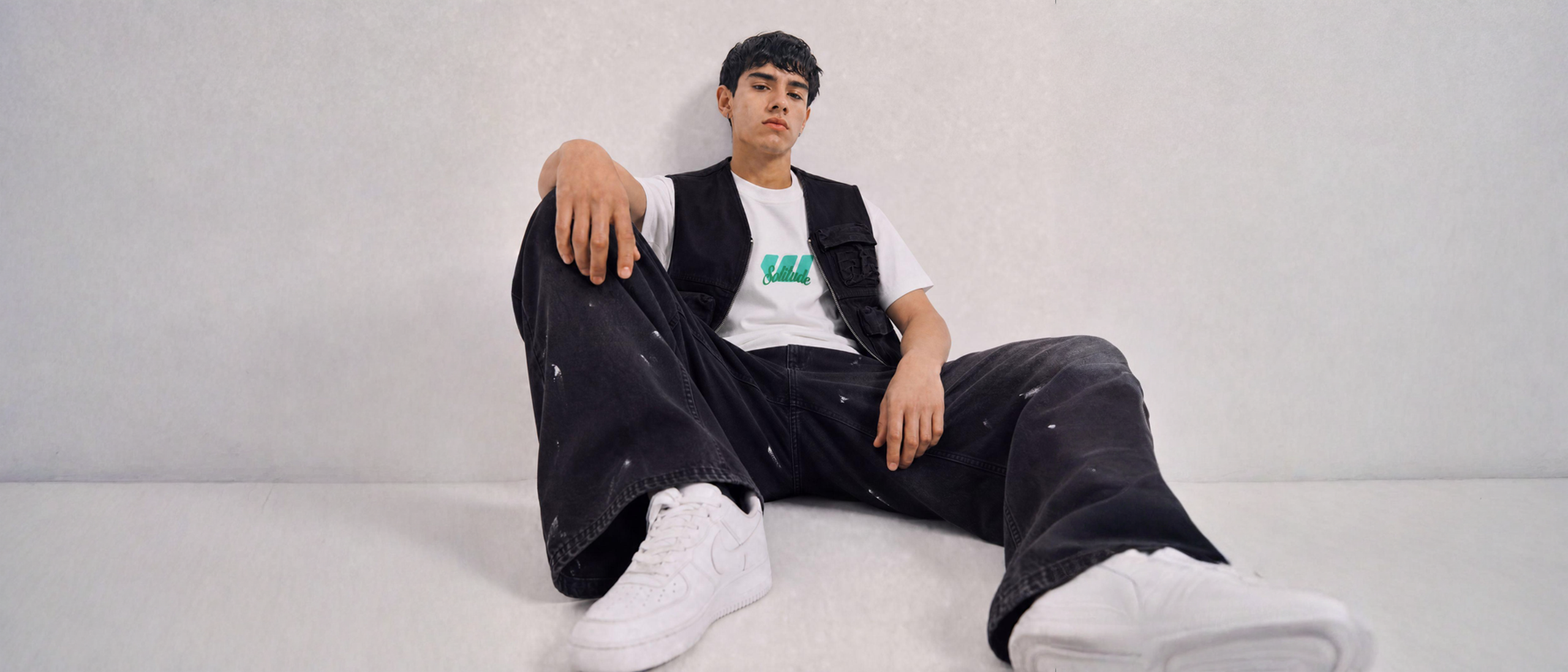 Man in Weezy Solitude graphic t-shirt, denim jacket and wide-leg jeans — End of Season Sale, 2 t-shirts for Rs 1,899
